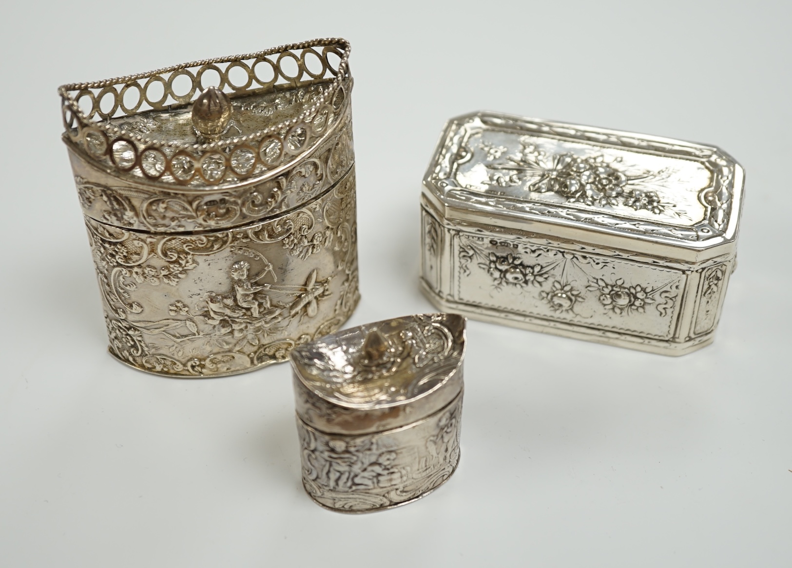 Three assorted late 19th century Dutch white metal boxes, largest 80mm.